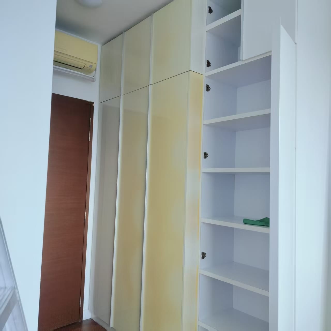 Yellowed white wardrobe before refurbishment in Singapore